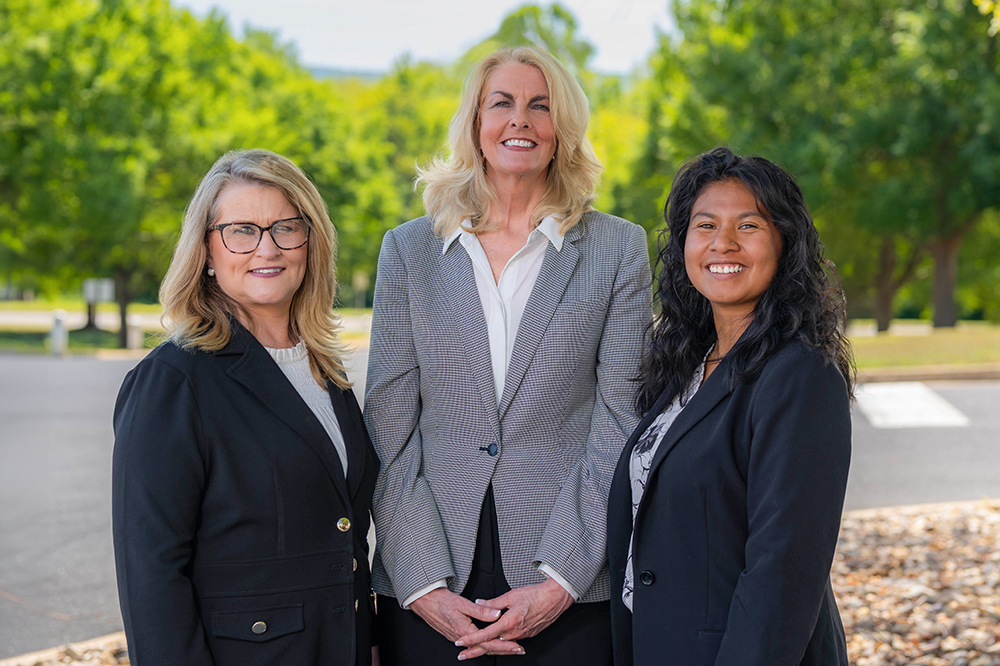 DCCU Cares team members, Jennifer Arteaga-Vargas, Sarah Landram and Margaret Hersh smile for the camera