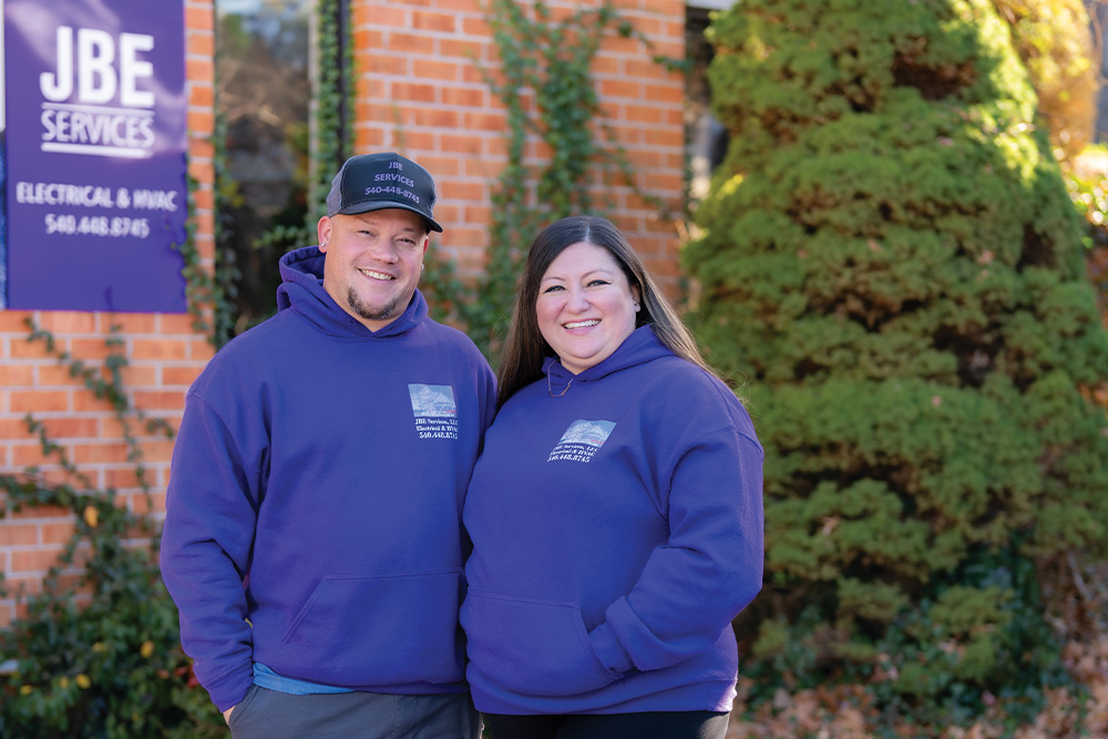 Elivs and Stefany Resto, owners of JBE Services, pose for the camera