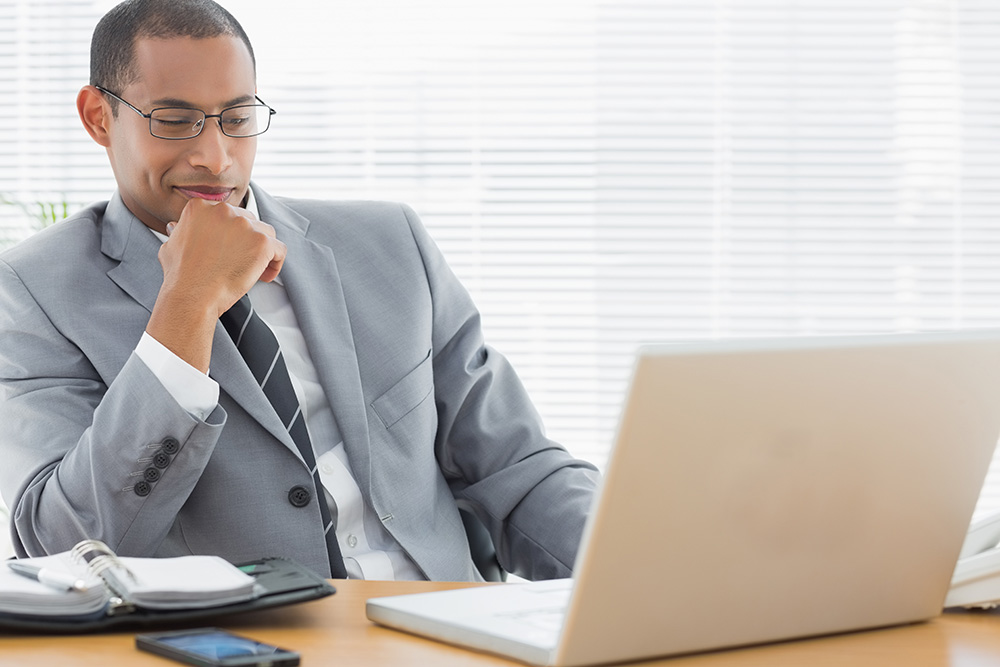 Business man looking at laptop