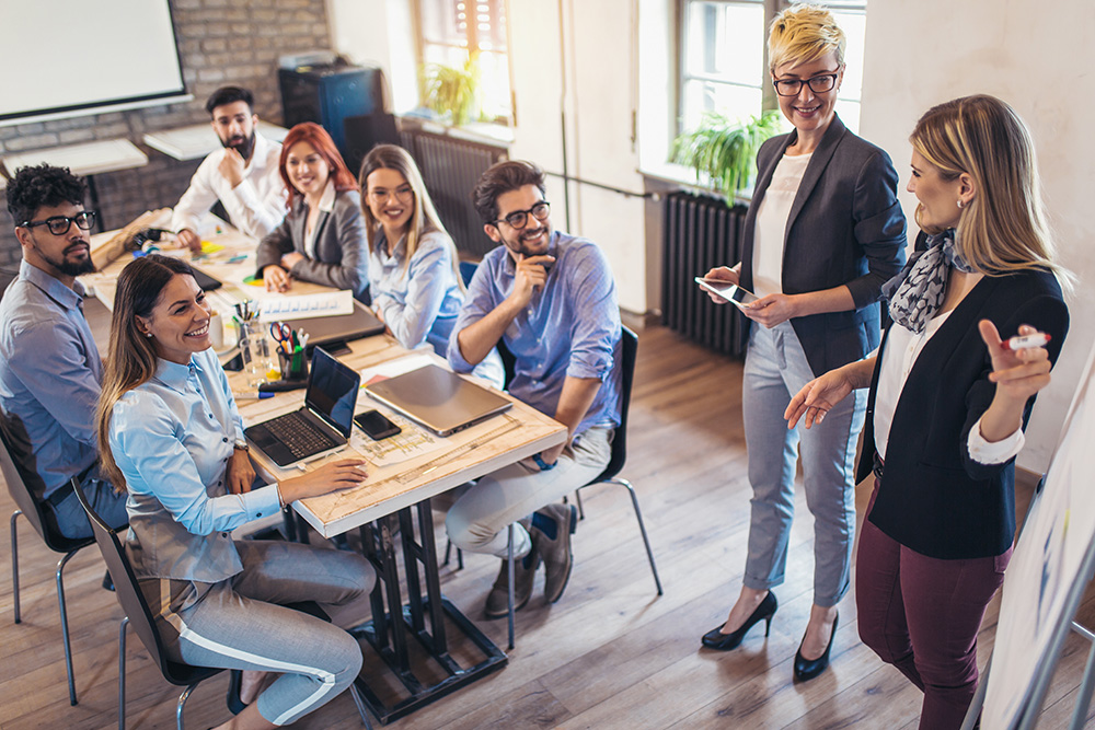 colleagues collaborating together in conference room