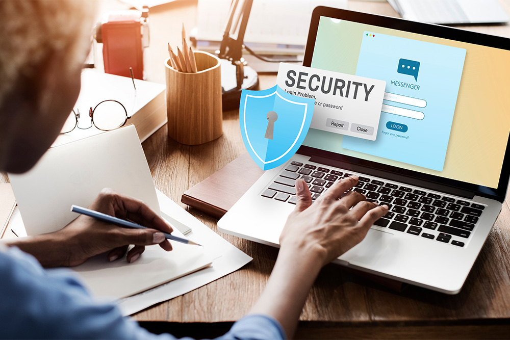 Woman sitting at laptop computer with the word "security" superimposed on image