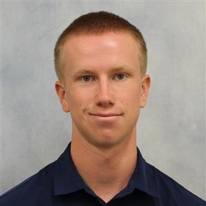 DCCU Seasonal Clerk, Sam, smiles for the camera in his headshot. 