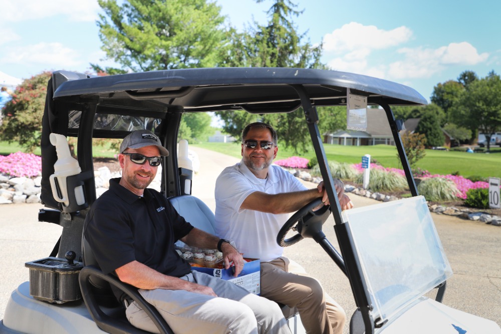 DCCU Chief Financial Officer, Steve Pittman, and DCCU President/CEO, Barry Smith, smile for the camera