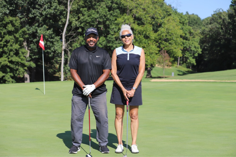 A group of golfers pose for the camera