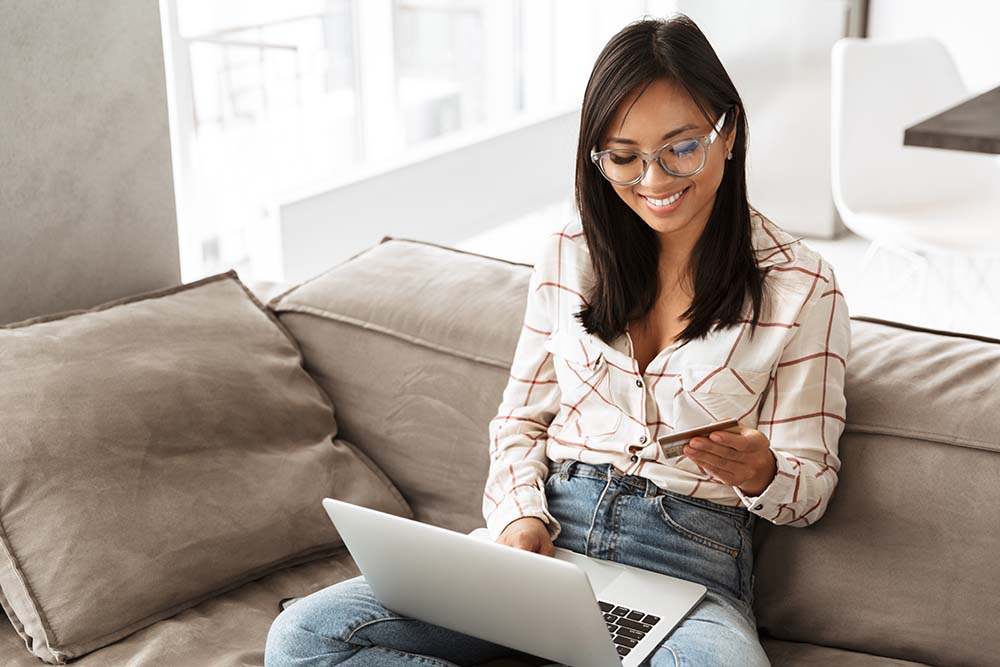 woman making a purchase online with a credit card