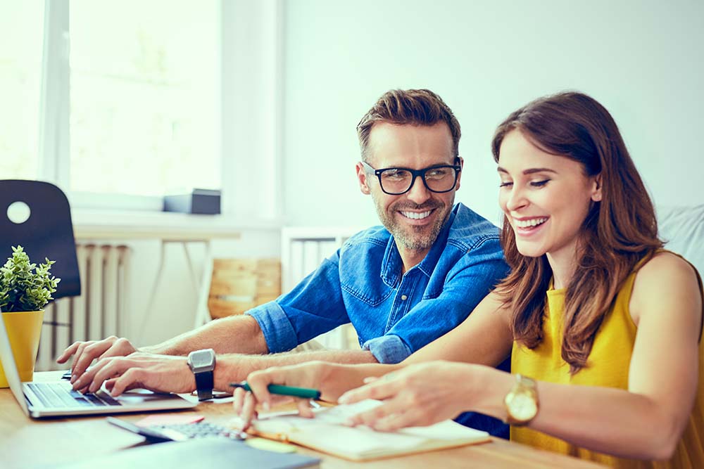 couple reviewing finances together happily