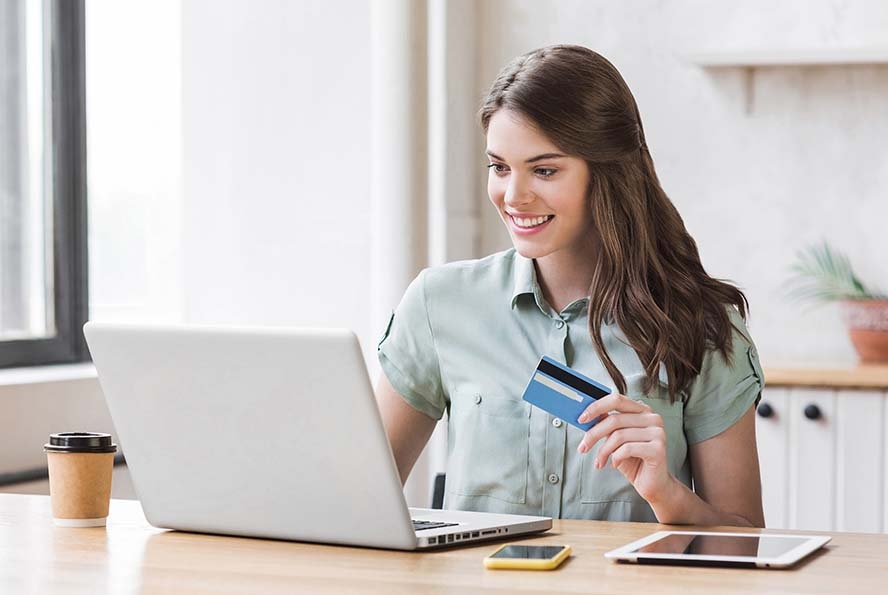 woman making a purchase online with a credit card